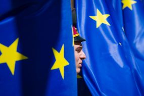 Warrior guard of honor near the flags of the European Union