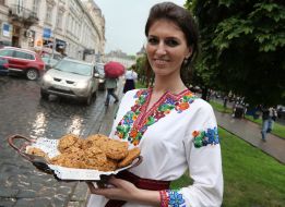 The girls in embroidered shirts handed out sweets to drivers