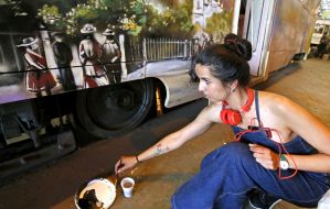 The artist paints the tram car