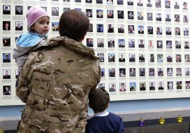 A woman cries near the "Wall of memory of victims of the unity of Ukraine"