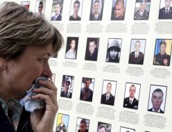 A woman cries near the "Wall of memory of victims of the unity of Ukraine"