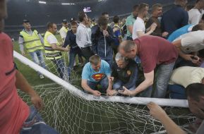 The fans break the gates