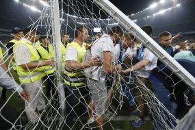 The fans break the gates