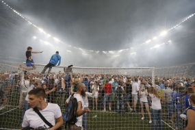 The fans break the gates