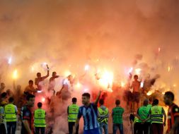 Fans with fires at the stadium