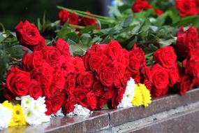 Flowers near the monument of Glory