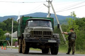 The soldier stops a truck