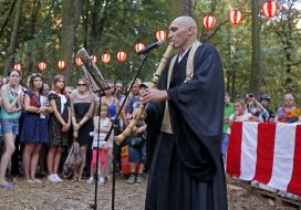 The musician plays on the Japanese folk instrument