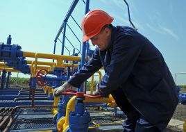 The operator turns the valve