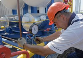 The operator turns the valve