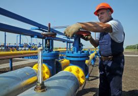 The operator turns the valve