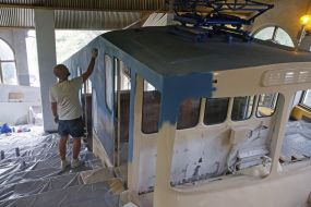 Aleksandr Korban paints the cable car