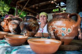 Woman paints pottery