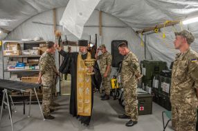 The priest holds the rite of consecration