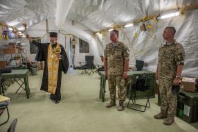 The priest holds the rite of consecration