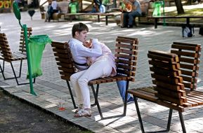 Young people sitting on a bench