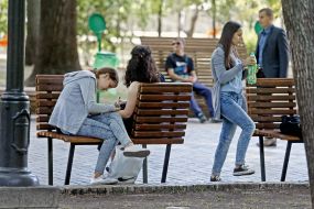 Young people sitting on a bench