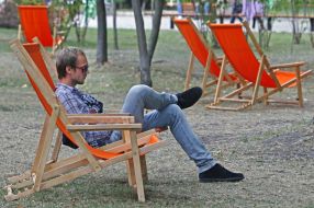 A man sitting in a lounge chair