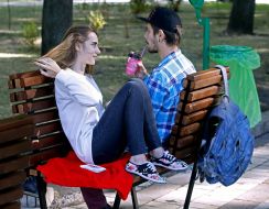 Young people sitting on a bench