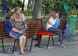 Young people sitting on a bench