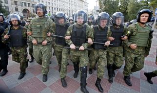 Law enforcement officers cordoned off the Polish football fans