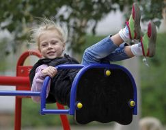 Girl riding on a swing