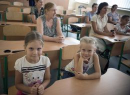 Children sit at their desks