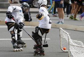 Children playing on roller hockey