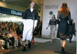 The models demonstrate clothes