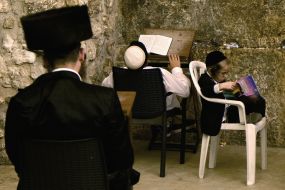 Hasidim pray near the Western Wall