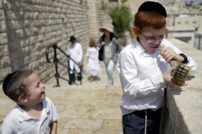 Hasidim pray near the Western Wall