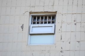 The detainee looks out the window jail