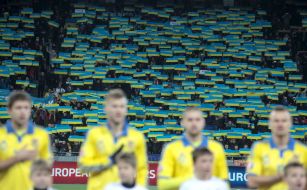 The supporters holding flags of Ukraine