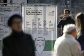 A man reads a program of a political party