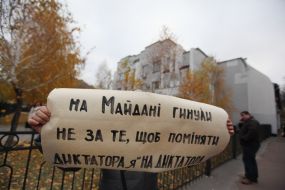 An activist holds a placard
