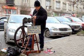 The man sharpens scissors