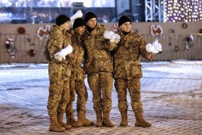 Soldiers photographed with pigeons