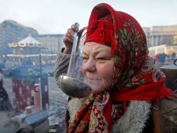 A woman tries to cooked food
