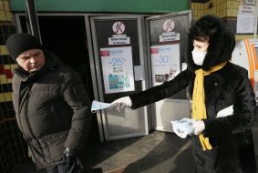 People distribute medical masks