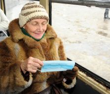 A woman wears a mask