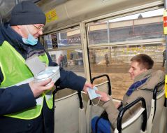 The man gives the man a mask