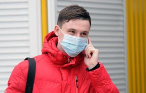 A young man in a mask