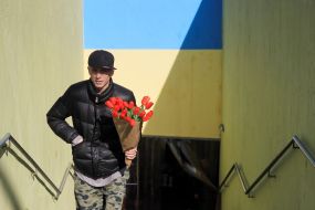 A man with a bouquet of tulips