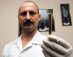 The surgeon holds the new magnetic surgical instrument