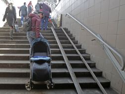 A girl with a baby carriage