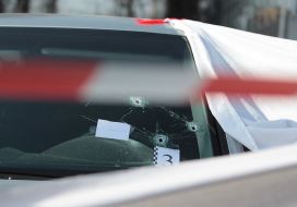 Bullet hole in the windshield of the car