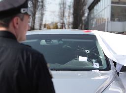 Bullet hole in the windshield of the car