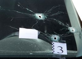 Bullet hole in the windshield of the car
