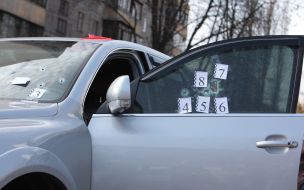 Bullet hole in the windshield of the car