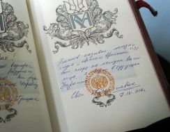 Writing in the book of honorable guests